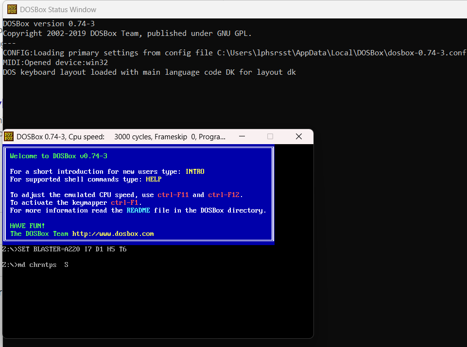 Screenshot of DOSBox 0.74-3 on Windows. Behind, the DOSBox Status Window logs its startup: settings loaded from C:\Users\lphsrsst\AppData\Local\DOSBox, a MIDI device opened, the Danish keyboard layout loaded. In front, the DOSBox window shows the blue welcome box, then two commands at the Z:> prompt: SET BLASTER=A220 I7 D1 H5 T6, which sets up the Sound Blaster, and md chrntps, which creates a folder for the demo.
